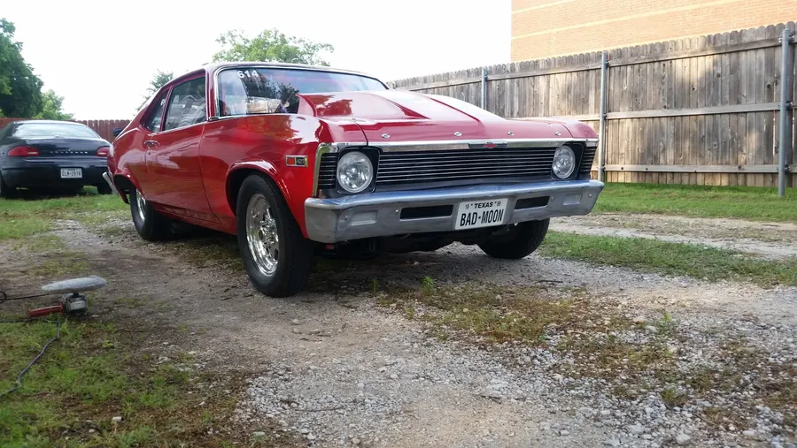 Red classic car finished three-quarter view
